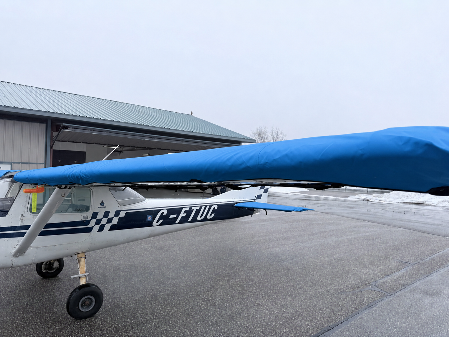 Cessna 150 aircraft with Mcovers all-weather wing and tail covers installed