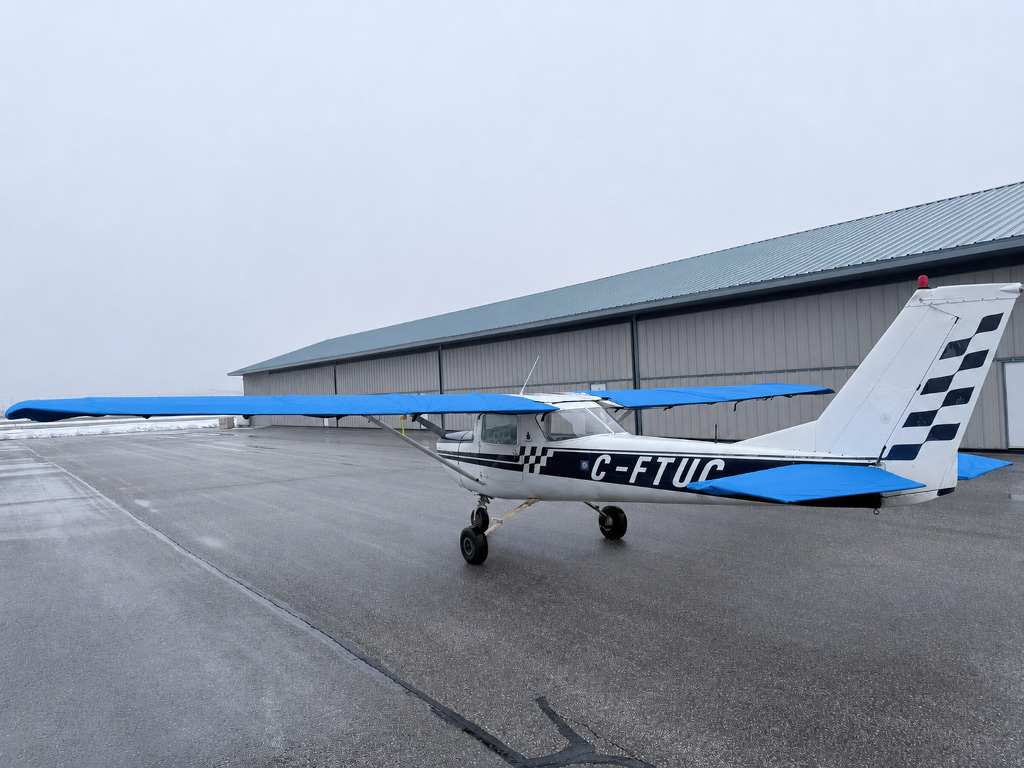 Cessna 150 aircraft with Mcovers all-weather wing and tail covers installed