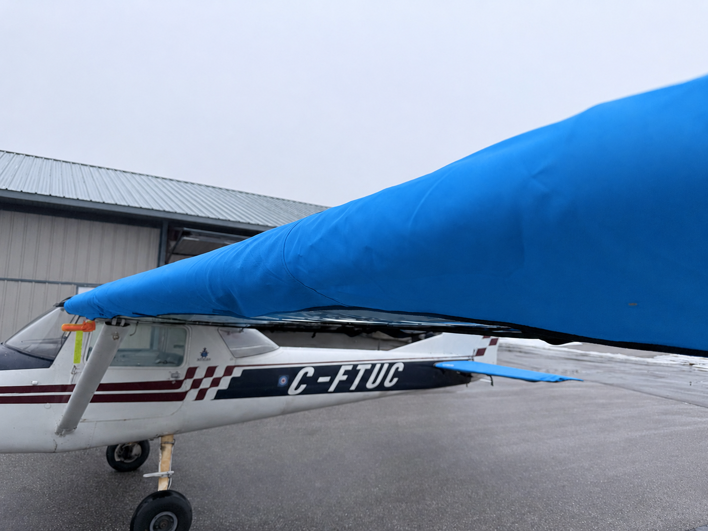 Mcovers blue wing and tail covers installed on a Cessna 150 aircraft