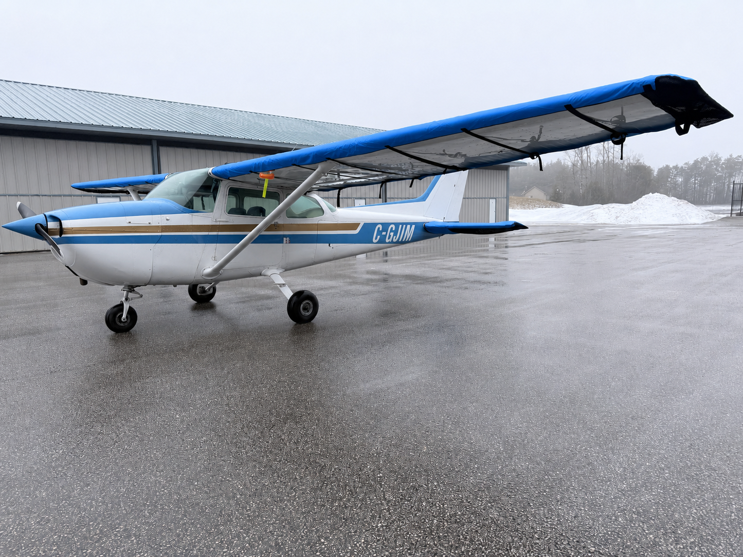 Close-up of Mcovers Cessna 172 wing cover fitment and strap system
