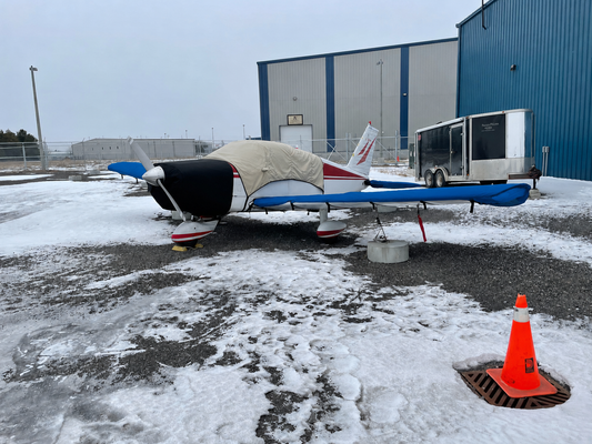 Mcovers blue wing and tail covers installed on a Piper Cherokee aircraft
